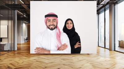 arab couple smiling and standing on white background Wall mural