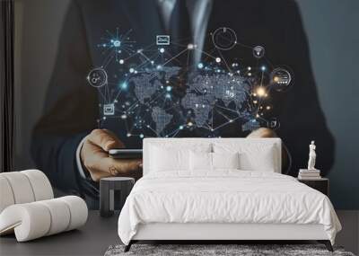 A businessman holds digital icons and smart devices with a global network connection design, showcasing the concept of online technology for business success design Wall mural