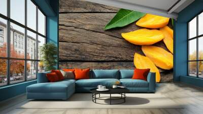 
A composition featuring dried mango chips alongside fresh sliced mango creates a beautiful contrast between the textures and colors of the fruit in its two different forms Wall mural