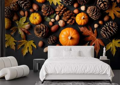 Autumn leaves, pumpkin, pine cones, and nuts on a black background with copy space. Thanksgiving concept. Flat lay, layout, room for text design Wall mural