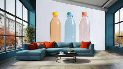 Colorful plastic water bottles on white background, closeup of photo Wall mural