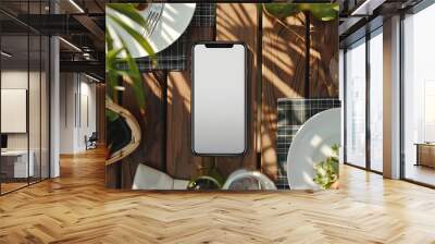 Phone mockup with blank screen on summer dinner table Wall mural