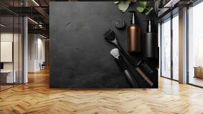 “Composition featuring hairdressing accessories and a spray bottle arranged on a black background. The design highlights professional tools and products, creating a sleek and modern aesthetic.” Wall mural