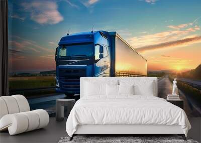 Blue powerful big rig semi truck on the highway at sunset Wall mural