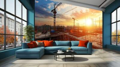 Construction of large residential buildings with crane at sunset Wall mural