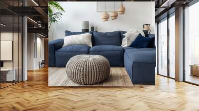 Living room interior design with two knitted poufs near dark blue corner sofa Wall mural