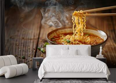 Bowl of instant noodles isolated on wooden background, noodles with chopsticks Wall mural