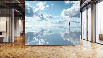 A perfectly flat plain covered in reflective material that mirrors the sky above Wall mural