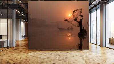 fisherman with sunrise on boat over river Wall mural