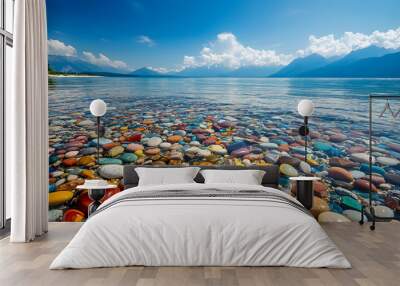 The sea is full of colorful pebbles, and the pebble beach on both sides is covered with many colored glass stones Wall mural