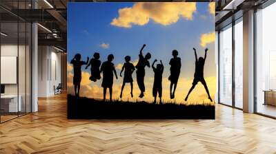 silhouette of children friendships in sunset Wall mural