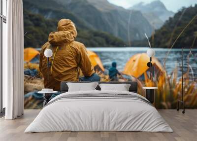 Man hiking outdoors in nature, relaxing by the lake. Wall mural