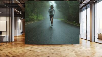 Handsome jogger running in the exotic area Wall mural