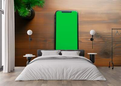 mockup mobile phone with green screen on wooden table top view layout Wall mural