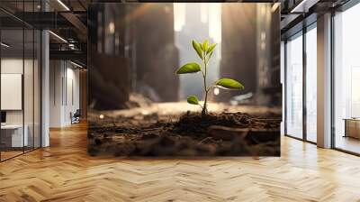 A small, green plant miraculously sprouts from a crack in the concrete of a city alleyway, symbolizing resilience and hope in the urban jungle Wall mural