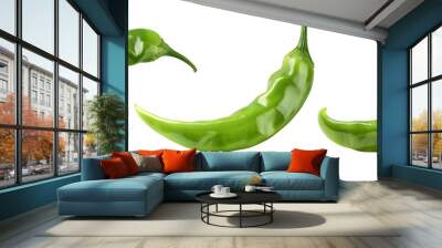 Three green chili peppers isolated on black. Wall mural