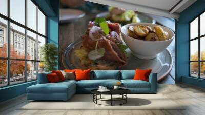 Close up of delicious nordic dish with salad, potatoes and meat Wall mural