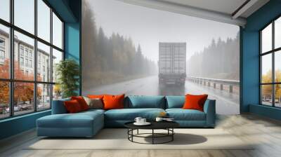 Big rig semi truck with refrigerator unit on reefer trailer transports commercial industrial cargo on a multi-lines highway with wet shiny coating and rain dust in rainy weather. Wall mural