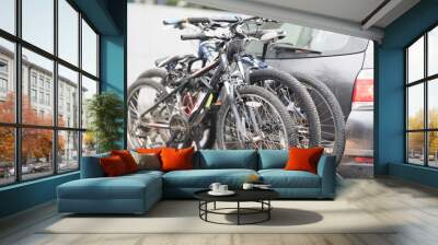 car is transporting bicycles on rack. bikes on the trunk Wall mural