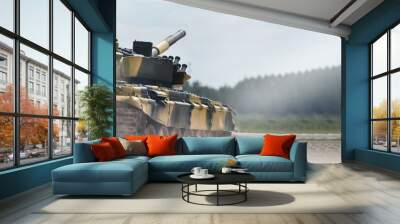 Military or army tank ready to attack and moving over a deserted battle field terrain. a lot of dust. copyspace Wall mural