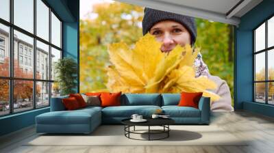 Beautiful brunette woman in autumn yellow park Wall mural