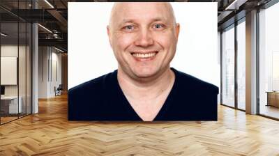 Portrait of a bald cheerful man on a white background Wall mural