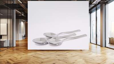 silverware forks spoons knives cutlery on a white background Wall mural