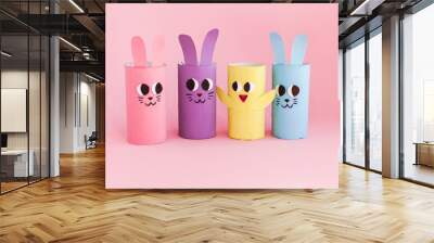 Holiday easy DIY craft idea for kids. Toilet paper roll tube toy's cute rabbit's on pink background banner. Creative Easter, Christmas decor, eco-friendly decoration, reuse, recycle handmade concept Wall mural