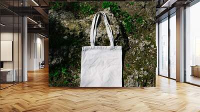 White blank tote mesh bag for shopping on stone, moss and grass background. Mock up, blank eco shopper, place for logo or text. Top view Wall mural