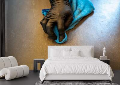 close up of professional cleaner cleaning grout with a blue cloth rag and foamy soap on a gray tiled bathroom floor Wall mural