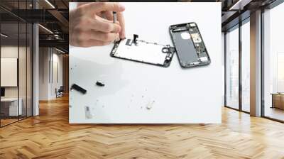 Close-up photos showing process of mobile phone repair Wall mural