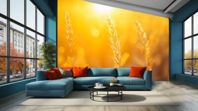 Golden wheat field at sunset with a vibrant sky, showcasing the beauty of agriculture and nature Wall mural