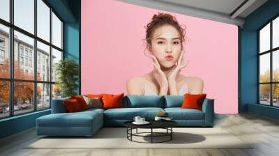 Beautiful Young Woman with Clean Fresh Skin touch own face . Facial treatment . Cosmetology, beauty and spa. Wall mural