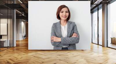 Entrepreneur young asian woman, business woman arms crossed on white background. Wall mural