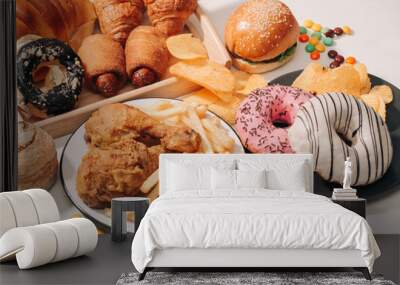 fast food and unhealthy eating concept - close up of fast food snacks and cola drink on white table Wall mural