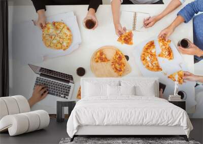 Lunch and people concept. Happy business team eating pizza in office Wall mural