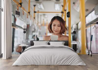 The passenger use smartphone in the bus or train, technology lifestyle, transportation and traveling concept Wall mural