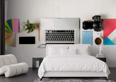 work space for photographer, graphic designer. flat lay of laptop, camera, colorchart, digital table Wall mural