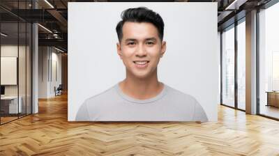 Young Asian man close up shot isolated on white Wall mural