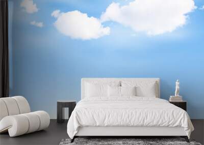 Grass lawn with clouds and sun on blue sky Wall mural