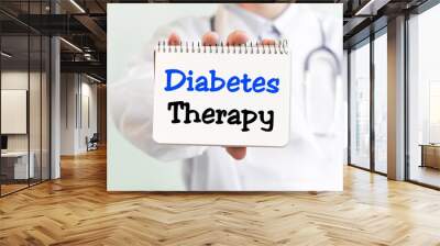 Doctor holding a card with text DIABETES THERAPY medical concept Wall mural