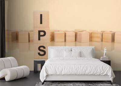 ips - acronym from wooden blocks with letters, investment policy statement concept on yellow background. copy space available Wall mural