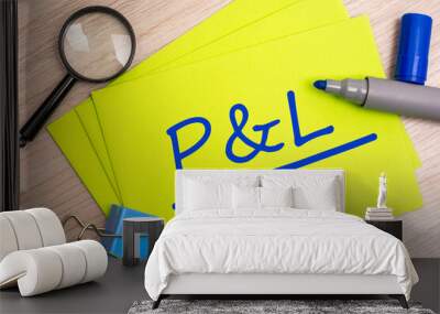 P and L - profit and loss - acronym text concept with marker on yellow business card Wall mural