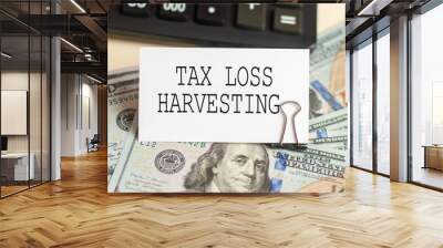 text TAX LOSS HARVESTING written on white paper note on calculator, business concept Wall mural