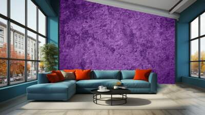 A purple wall with a textured surface. The wall is painted in a purple  Wall mural