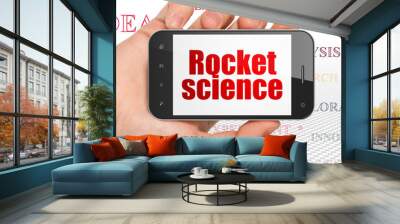 Science concept: Hand Holding Smartphone with  red text Rocket Science on display,  Tag Cloud background, 3D rendering Wall mural