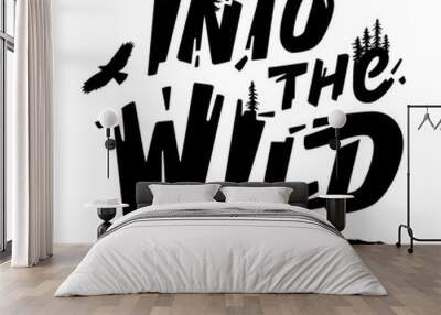 Hand-drawn type lettering. Inscription Into the Wild with a silhouette of Pine Trees, Hawk, and bear claws scratch. Design for a t-shirt, postcard, etc. Typography design. Wall mural