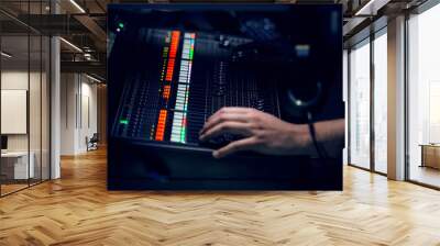 Professional sound engineer console at concert. Remote control for sound engineer. Professional audio sound mixer console and music equipment, electronic device. Concert sound engineer hands at work. Wall mural