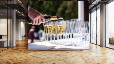 pouring champagne into glass Wall mural