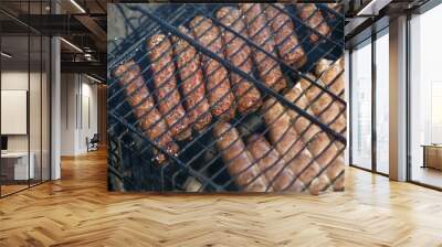 Sausage fire-roasted on the grill Wall mural